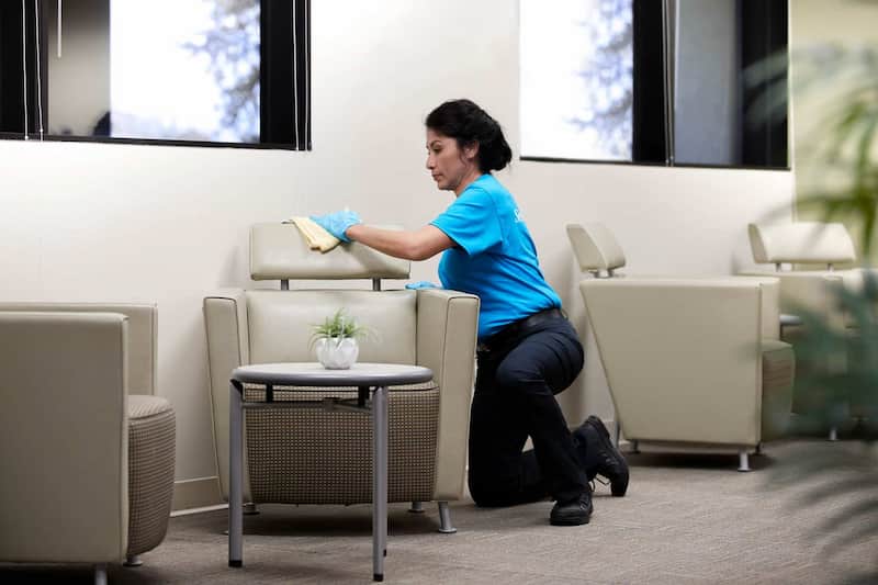 Woman cleaning table